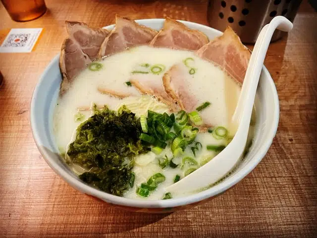 bowl of ramen with white spoon