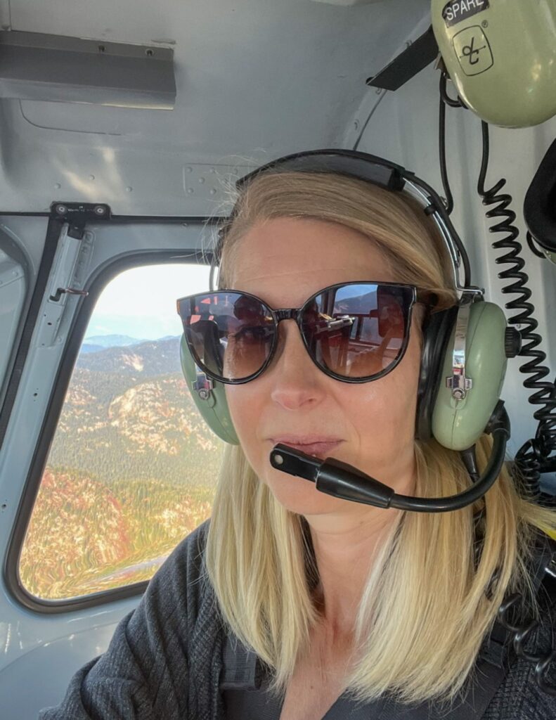 woman in helipcopter wearing headphones