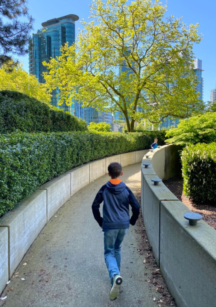 boy running on path in vancouver