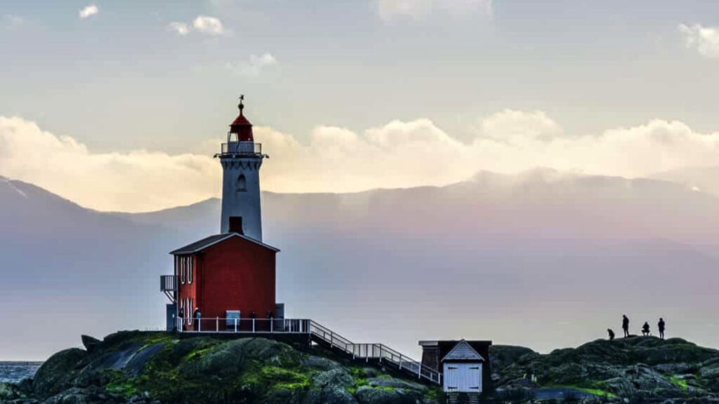 lighthouse and red building