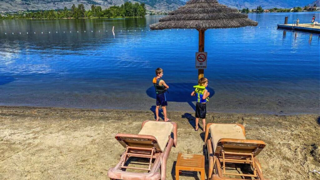 two boys on beach at lake osoyoos