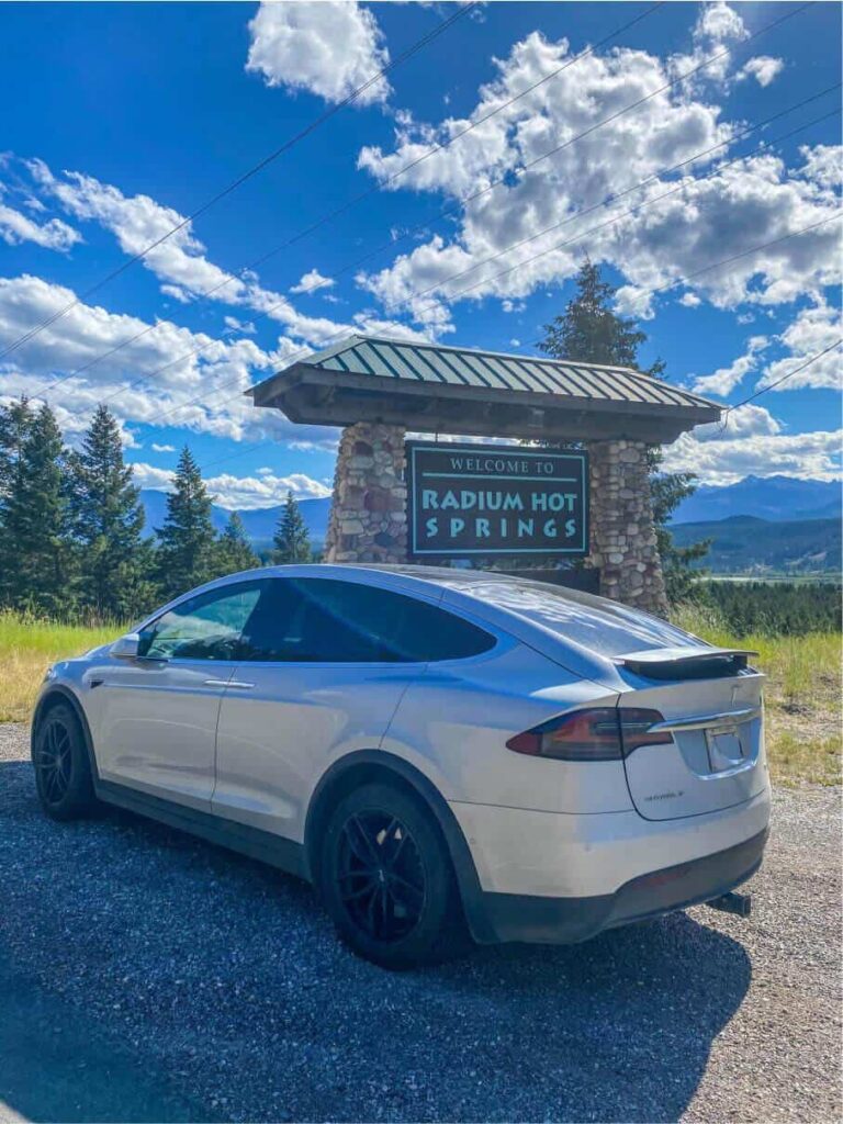 Tesla at the radium hot springs sign