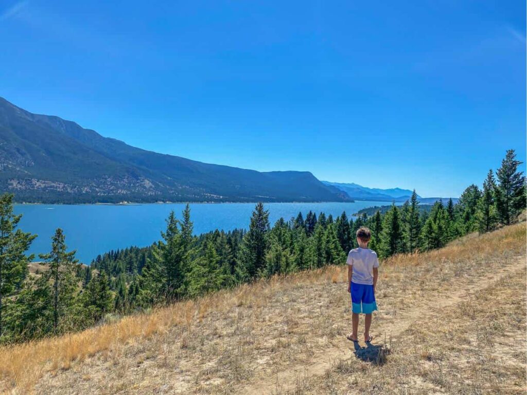 boy looking at lake