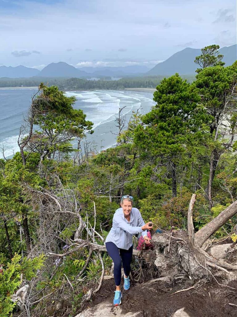 woman climbing up trail