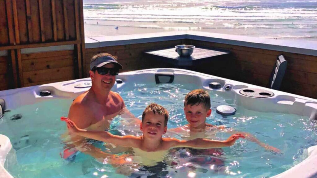 family in hot tub at pacific sands beach resort