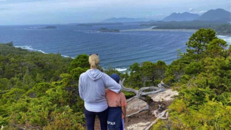 mother and son on trail overlooking ocean