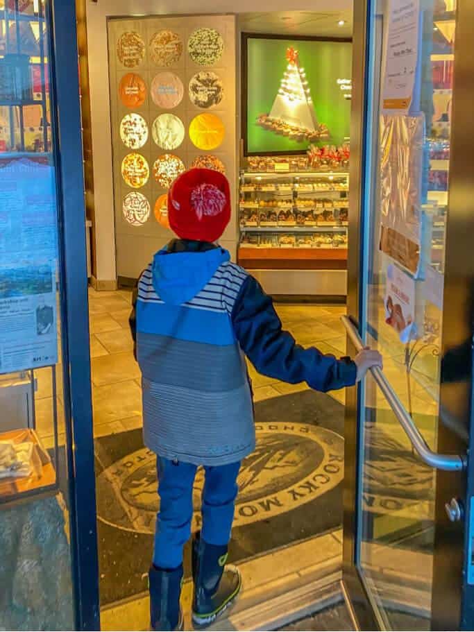 boy walking into store