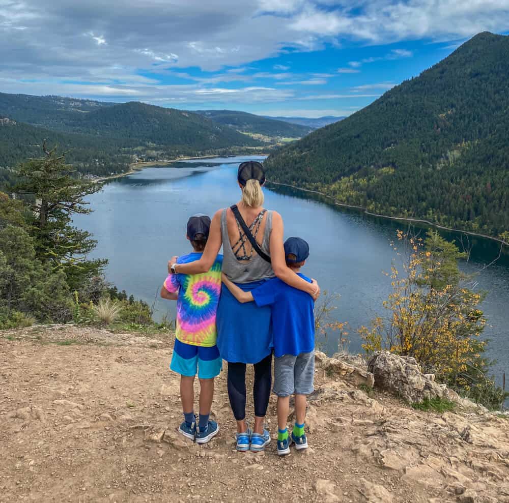 mother and sons at kamloops hikes summit